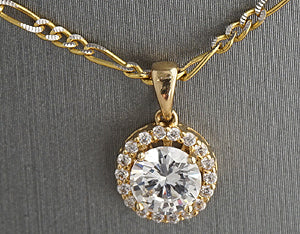 14k Gold round pendant studded with one carat cubic zirconia