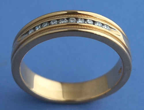 14k Gold band ring studded with channel set diamonds